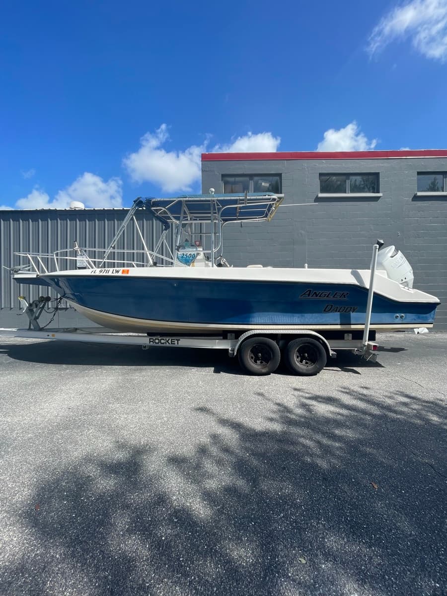Plain blue Angler Daddy boat hull before custom wrap