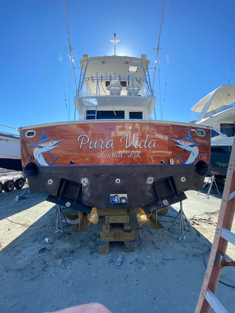 Pura Vida boat stern with custom marlin graphics by ATD Suncoast