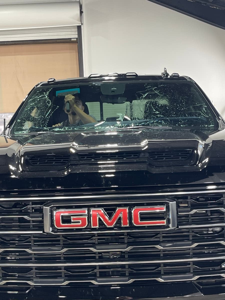 Windshield tint installation on GMC truck at ATD Suncoast