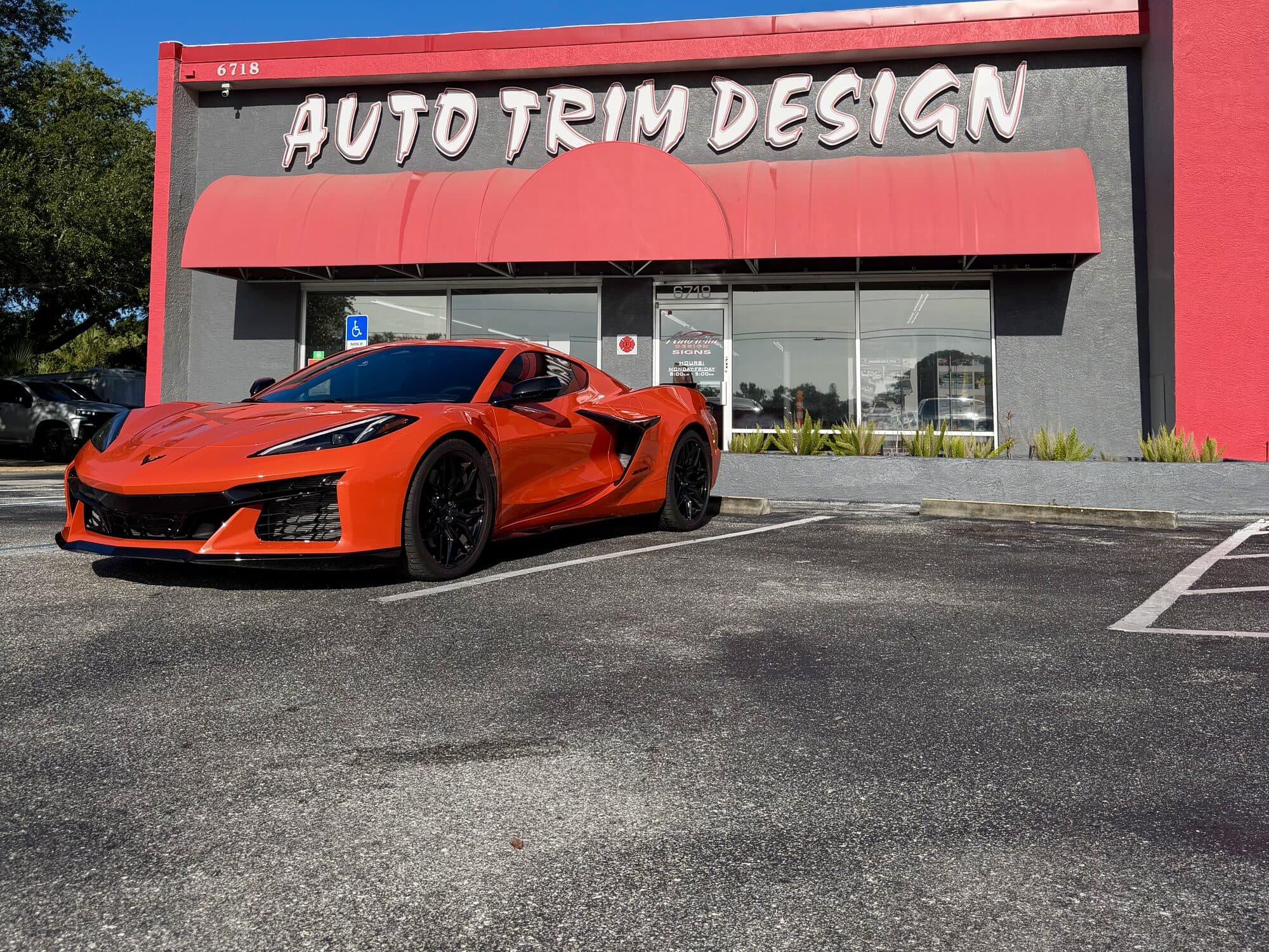 Orange Corvette Z06 with window tint outside Auto Trim Design Bradenton