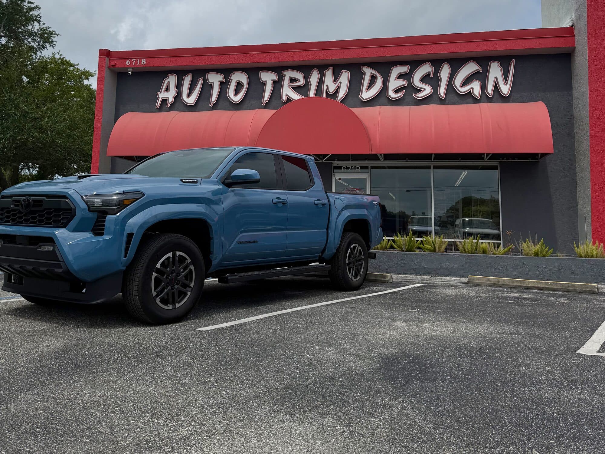 Blue Toyota Tacoma TRD with window tint by ATD Suncoast Bradenton