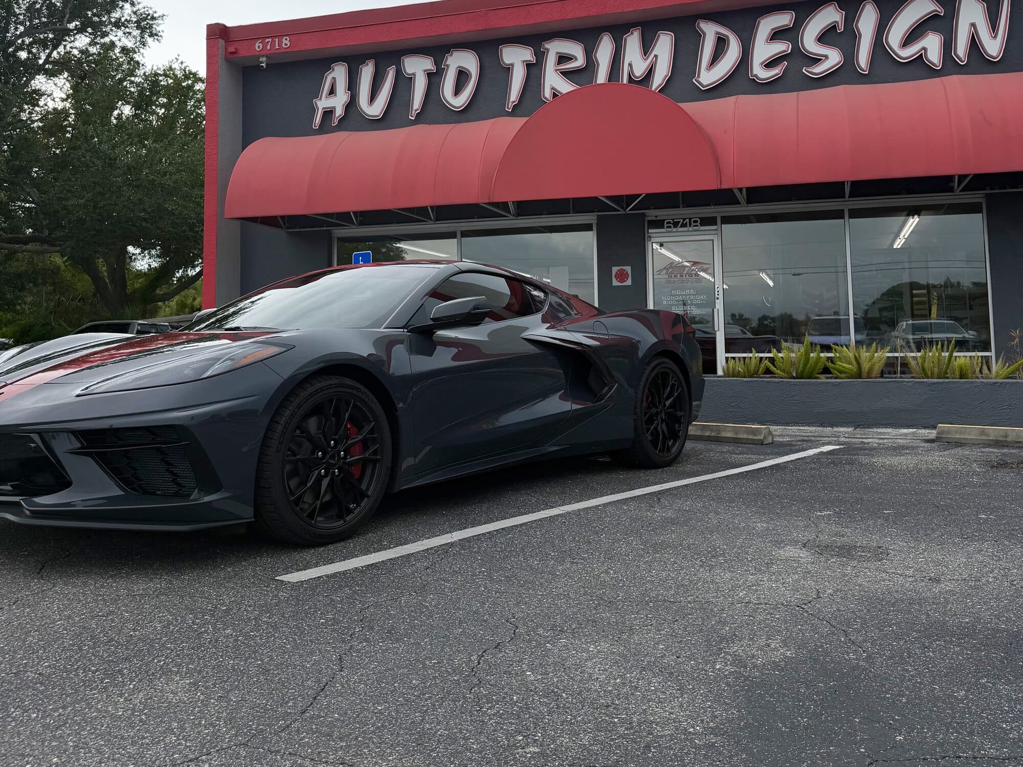 Gray Corvette C8 with window tint outside the ATD Suncoast shop