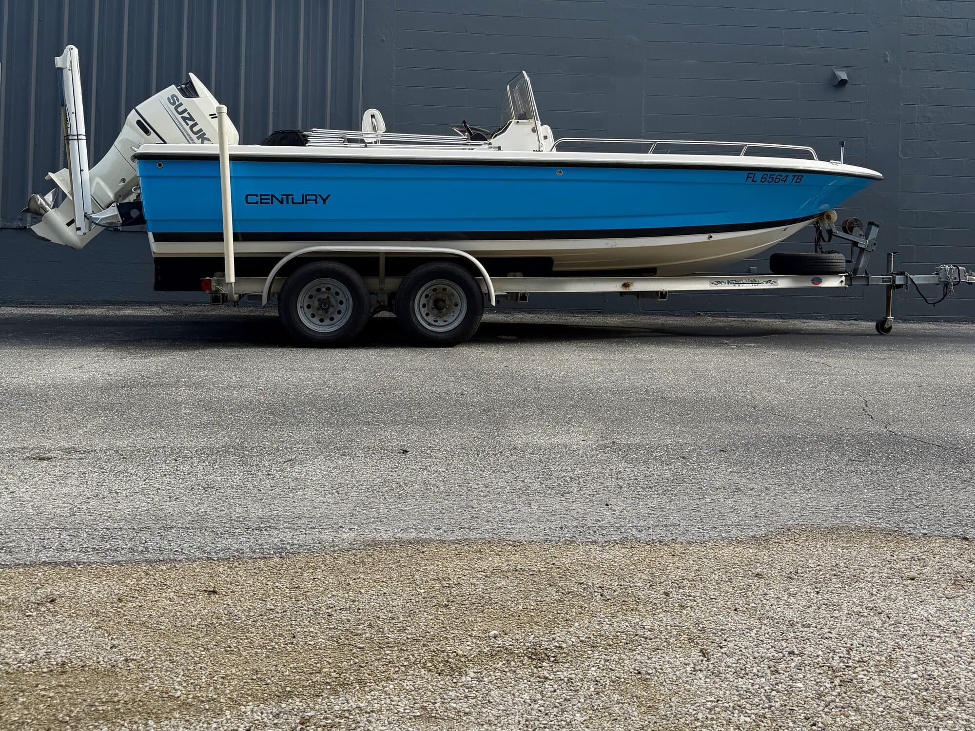 Century center console with blue hull wrap by Auto Trim Design